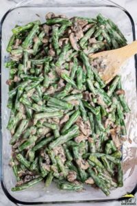 Green beans in a casserole dish with mushrooms