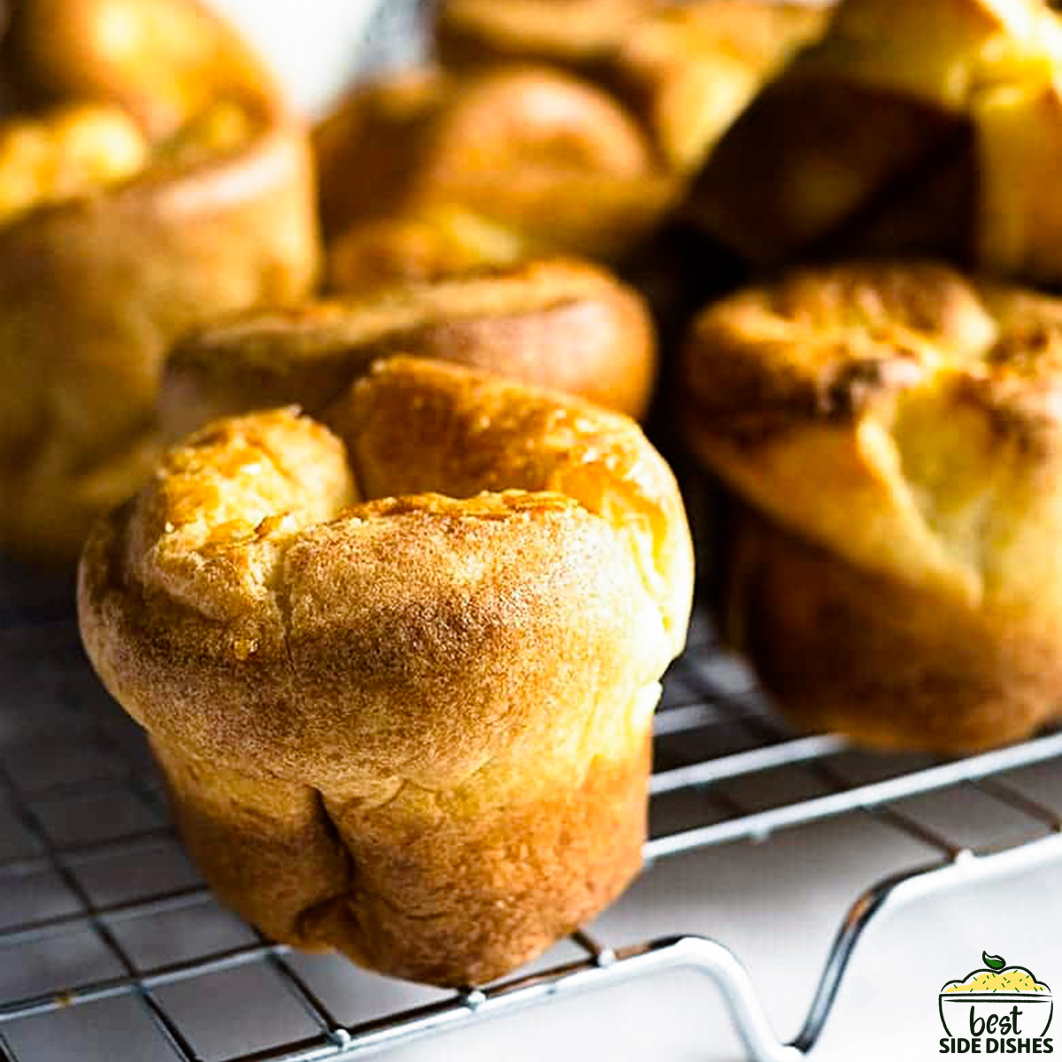Up close yorkshire puddings on a rack