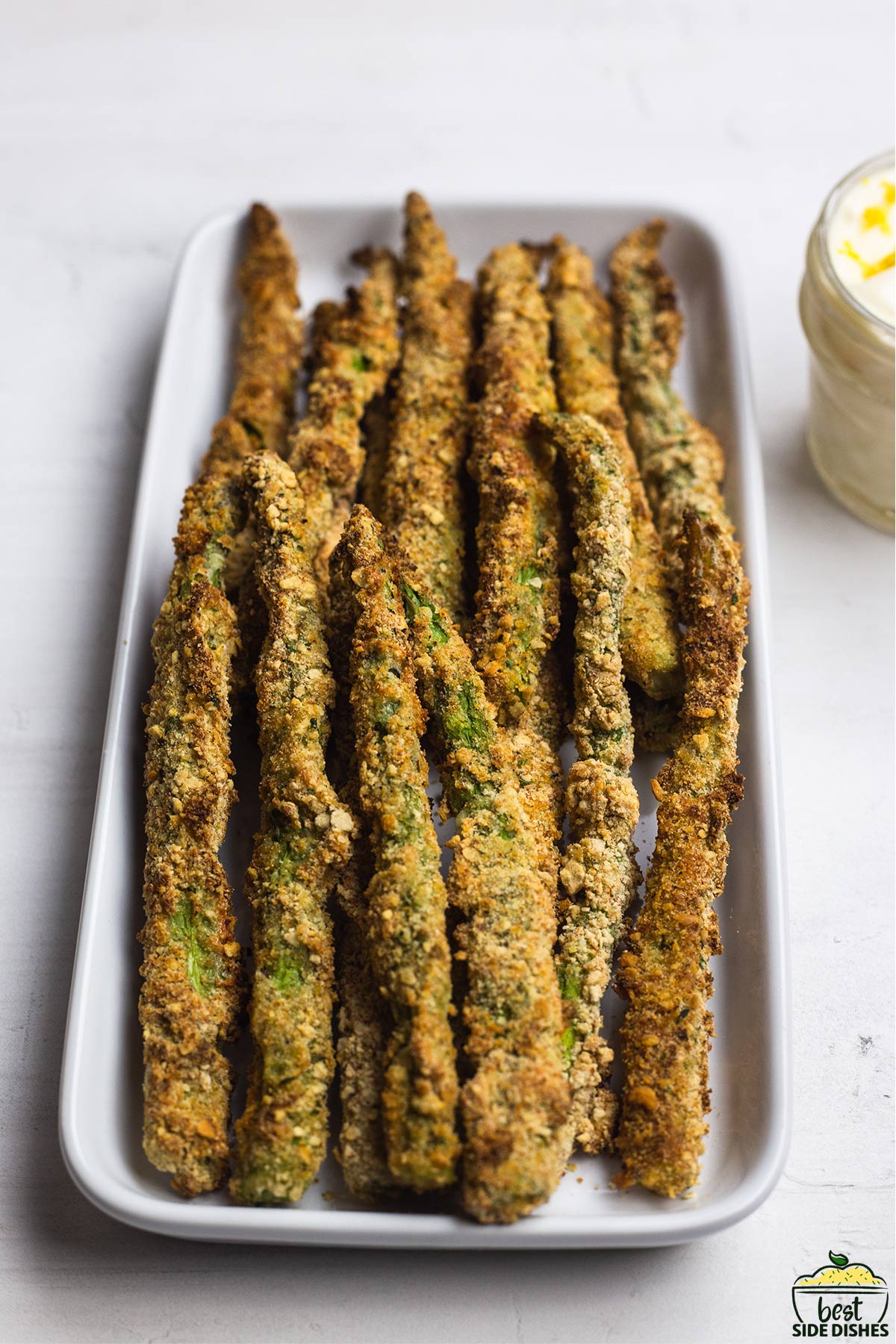 close up of asparagus fries on a platter