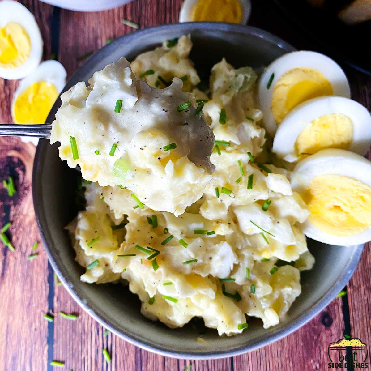 creamy instant pot potato salad in a bowl with egg slices