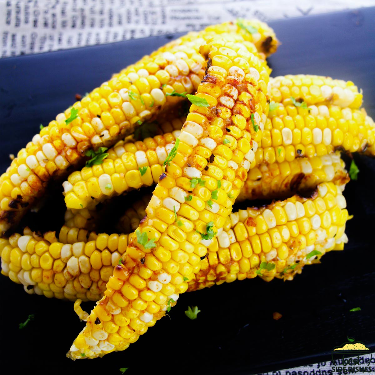 Corn ribs on a black platter