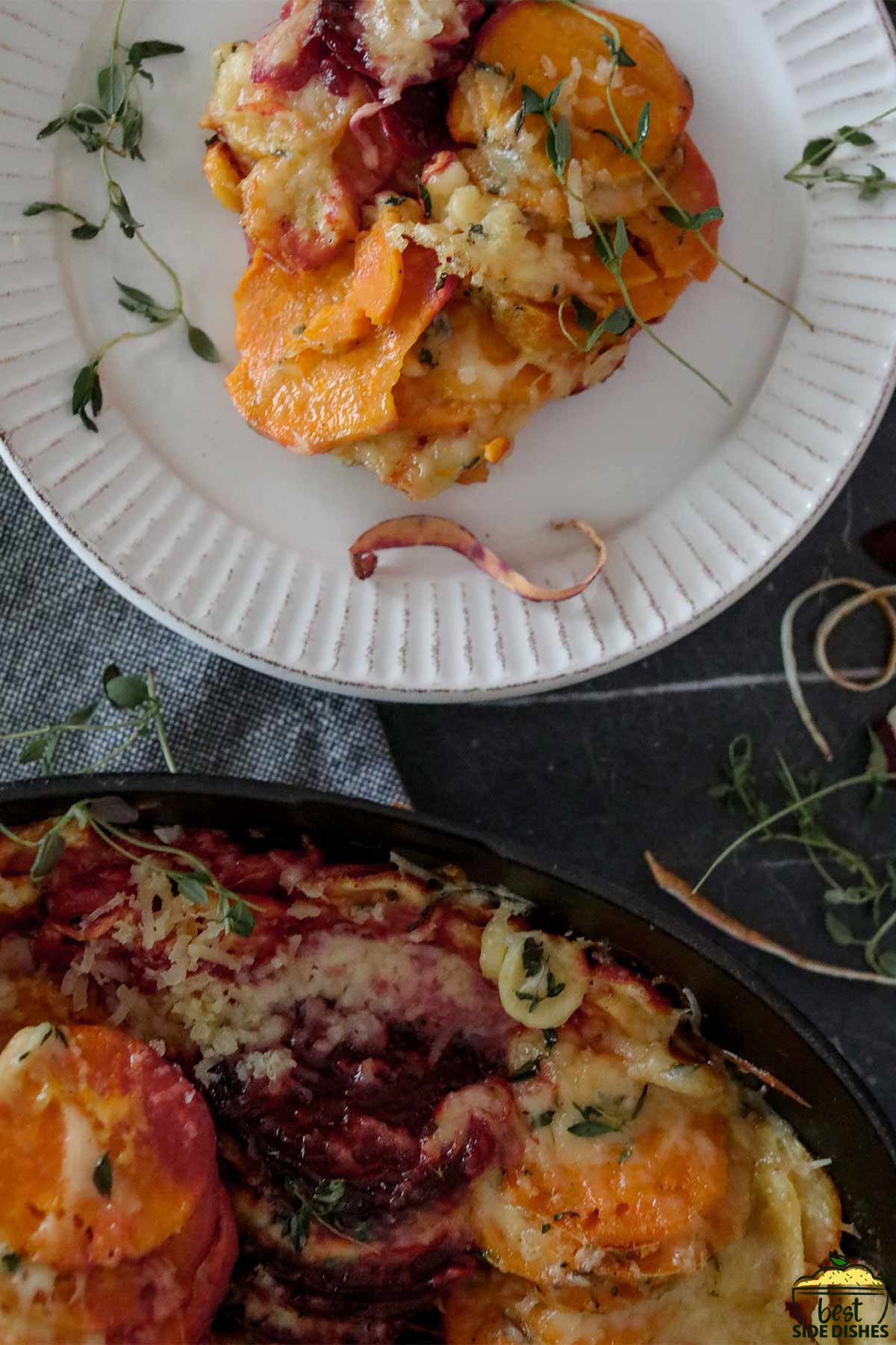 vegetable au gratin on a plate and in a cast iron skillet
