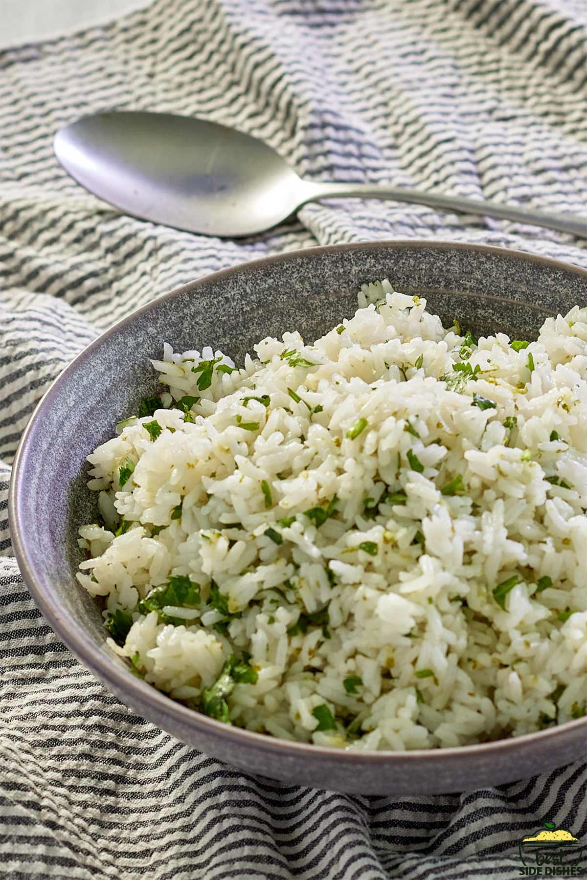 cilantro lime rice in a bowl with a spoon