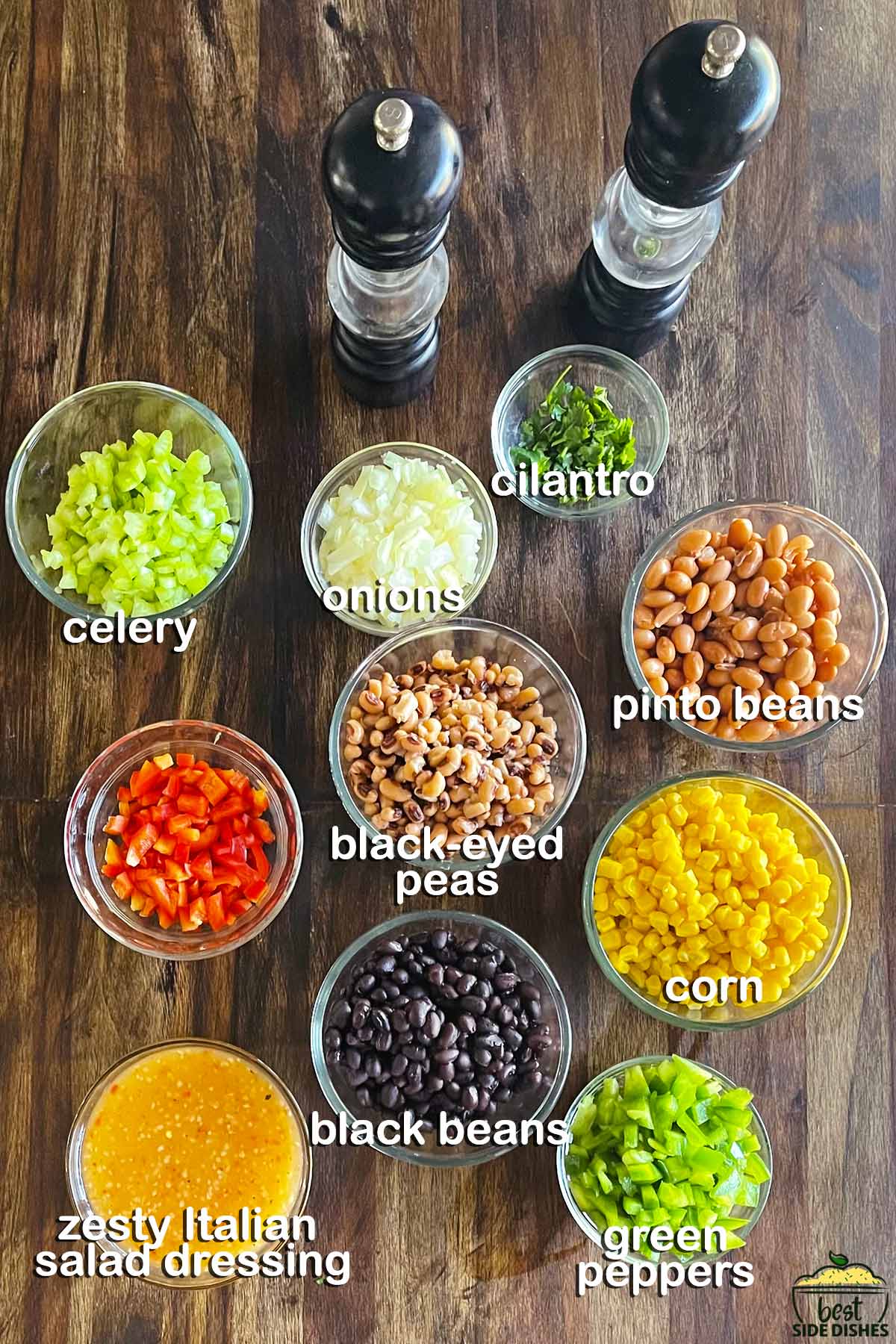 Black eyed pea salad ingredients in bowls with labels