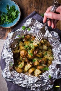 Forkful of baked potatoes in foil