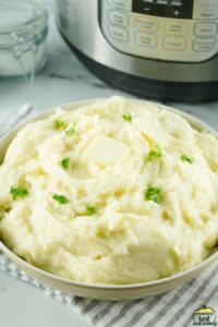 completed dish of mashed potatoes next to an instant pot
