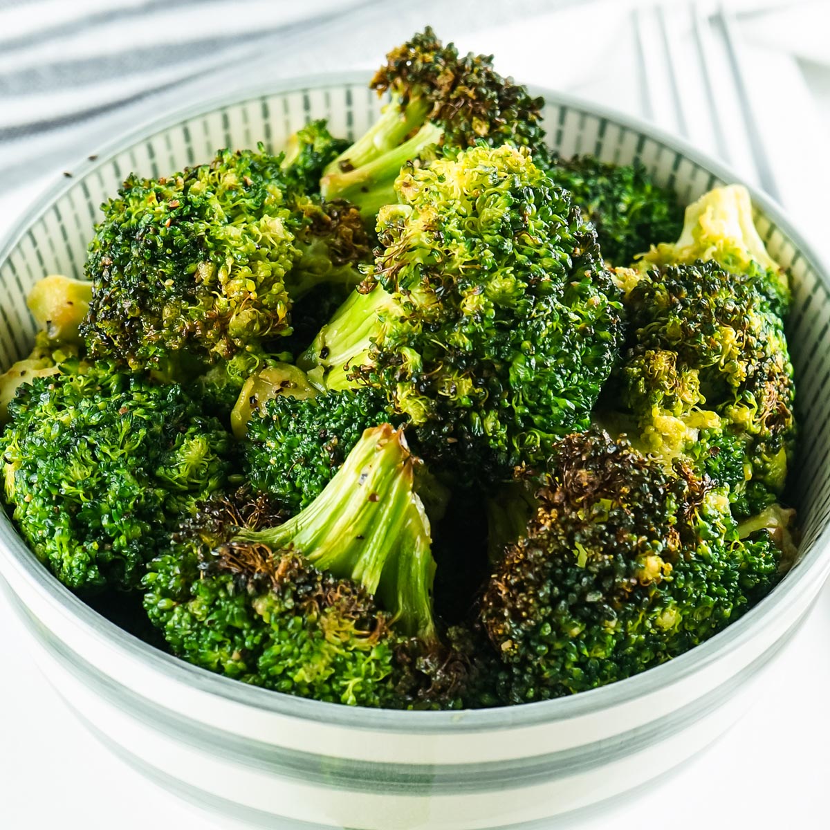 cooked broccoli in a white dish