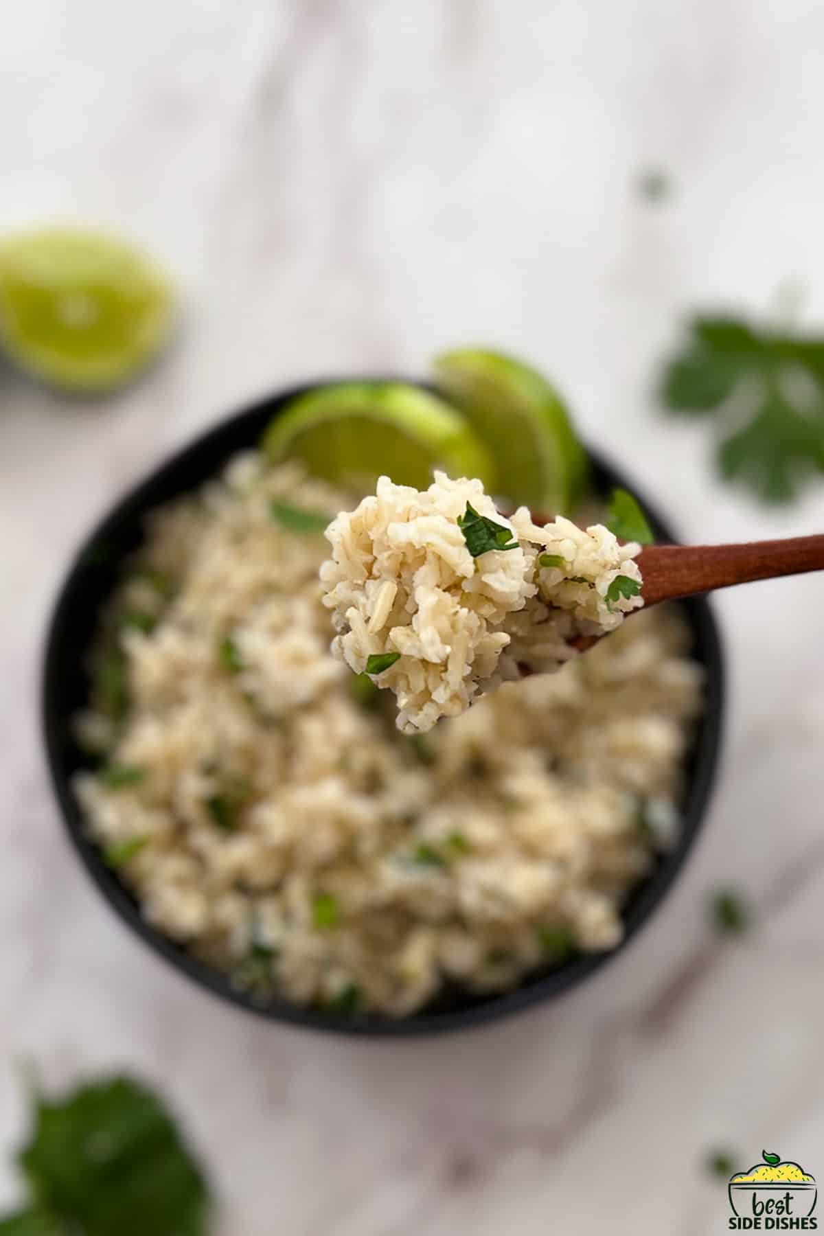 cilantro lime rice on a wooden spoon